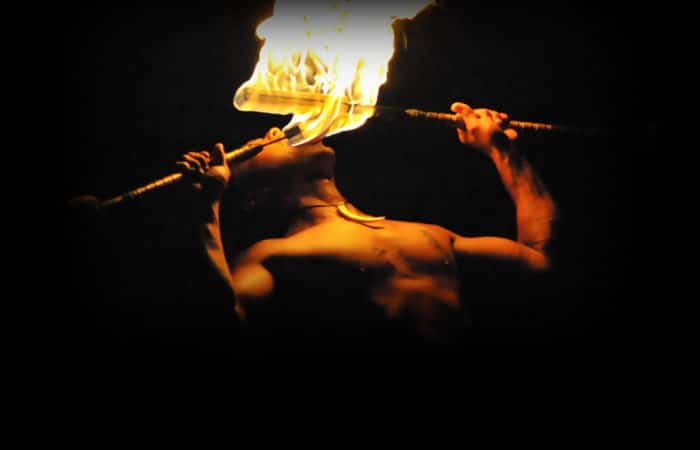man eating fire at luau kalamaku luau ceremony