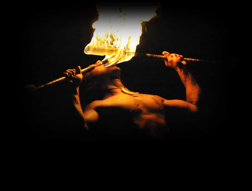 man eating fire at luau kalamaku luau ceremony
