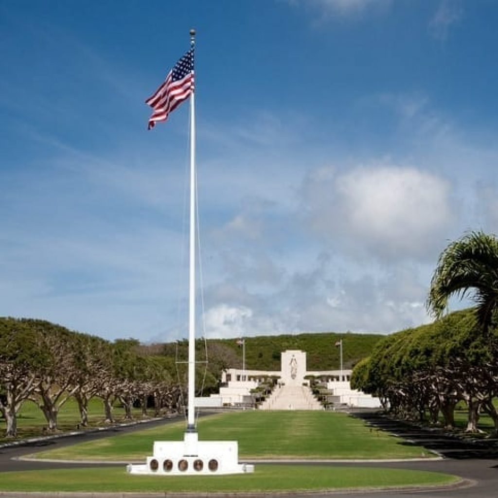 center of punchbowl national cemetery with us flag at full mast