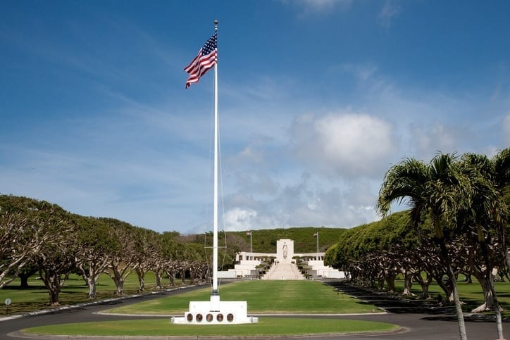 center of punchbowl national cemetery with us flag at full mast