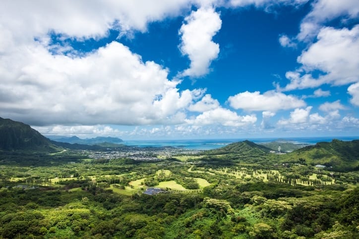 nu'uanu pali lookout - clouds above a deep green valley surrounded by ocean on all sides