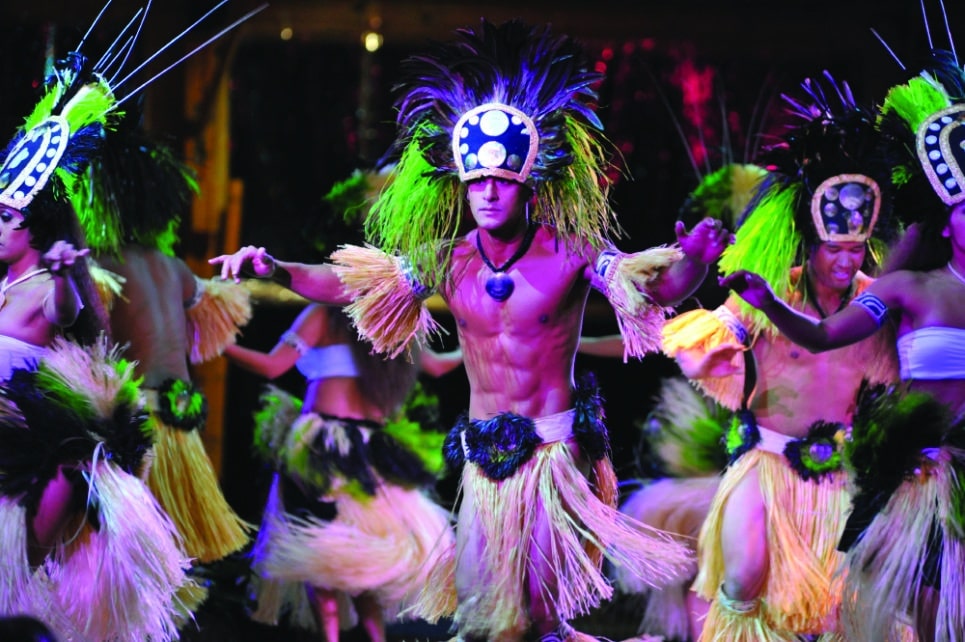 male dancer at luau kalamaku show - traditional dress and dancing
